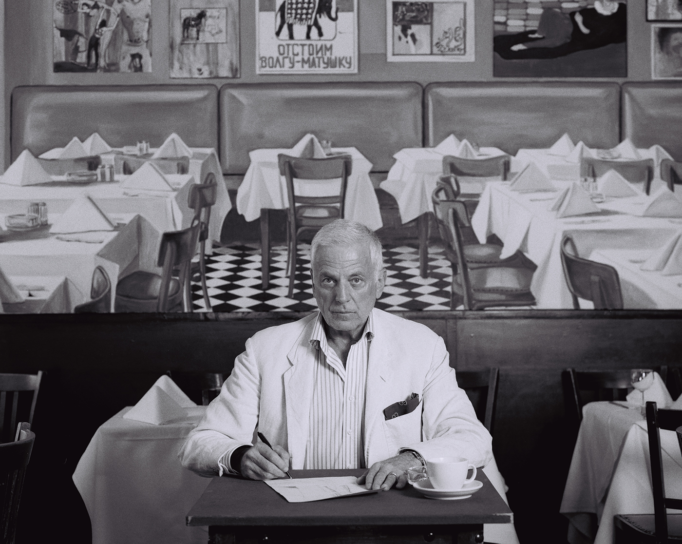 Michel Würthle in the Paris Bar in front of a painting by Martin Kippenberger photo: Diana Hohenthal for EDGE mag