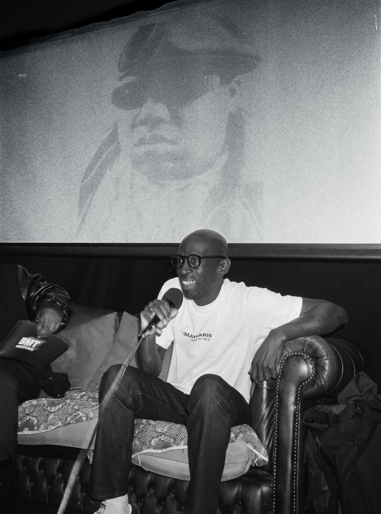 Tee Max talking during his opening event in  London photographed by Maria Haselhuber for EDGE mag
