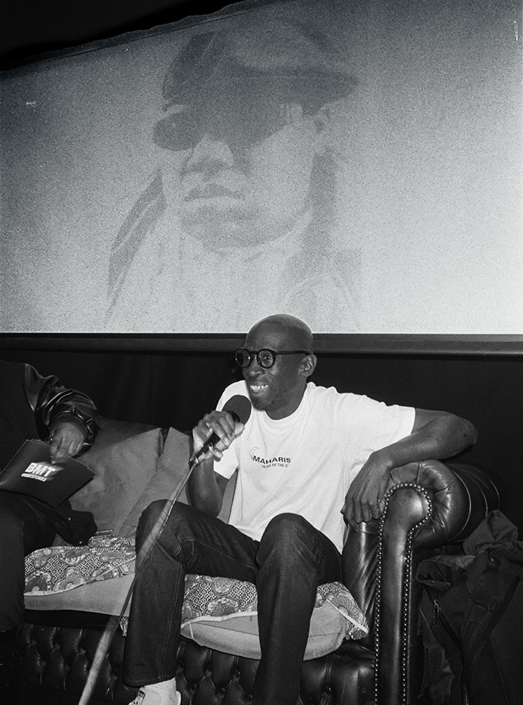 Tee Max talking during his opening event in London Tee Max talking during his opening event in London photographed by Maria Haselhuber for EDGE mag